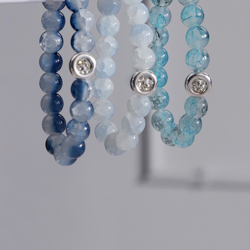 Olivenorma Armband mit blauen Glas-Kristallperlen 