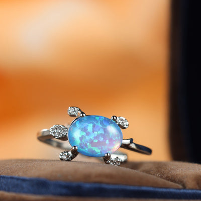 Olivenorma Süßer Meeresschildkröte Ring mit blauem Opal 