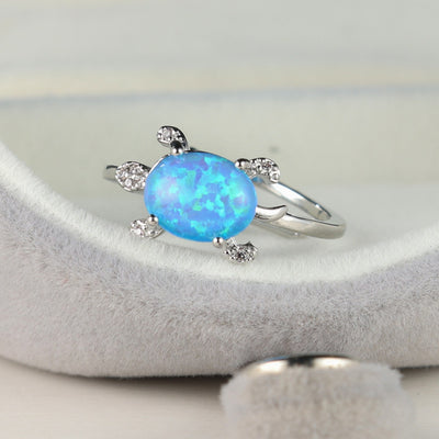 Olivenorma Süßer Meeresschildkröte Ring mit blauem Opal 