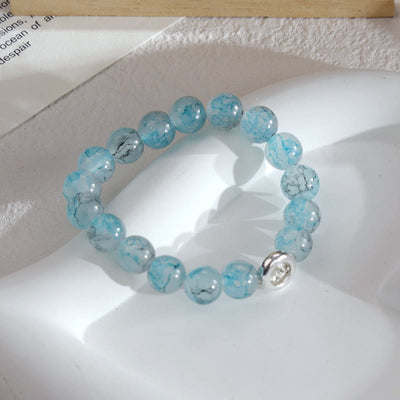 Olivenorma Armband mit blauen Glas-Kristallperlen 