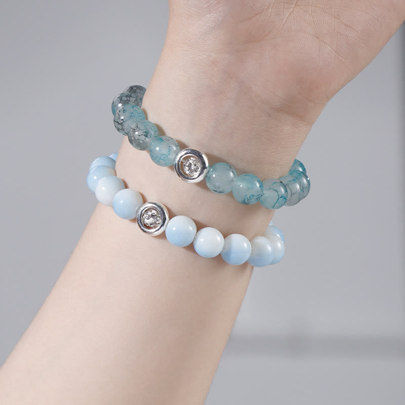 Olivenorma Armband mit blauen Glas-Kristallperlen 