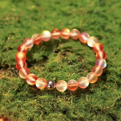 Olivenorma 8mm Meerjungfrauen-Glas Edelstahl Perlenarmband 