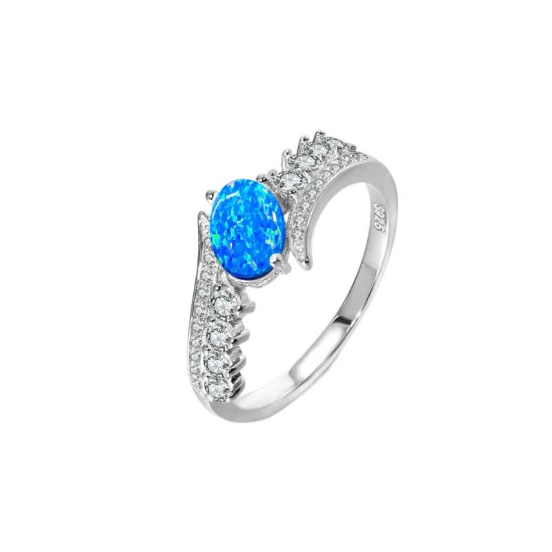 Olivenorma Ring mit Flügeln und natürlichem blauem Opal 