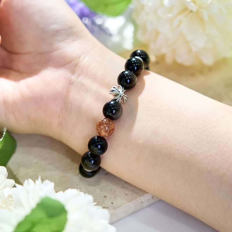 Olivenorma Armband mit Kreuzanhänger aus Sonnenstein und Obsidian in Silber 