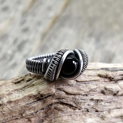 Olivenorma Herrenring mit schwarzem Onyx und Knoten