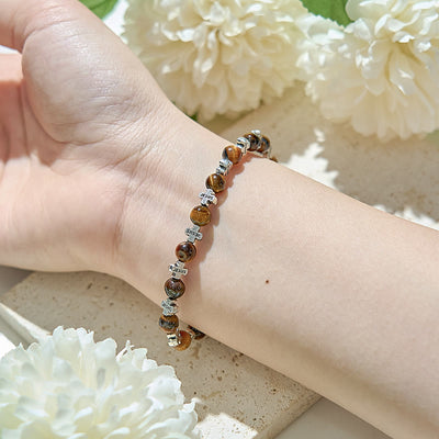 Olivenorma Armband mit Kreuzperlen aus natürlichem Tigerauge und Metall - image 1