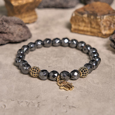 Olivenorma Armband mit Hamsa-Anhänger aus Hämatitperlen