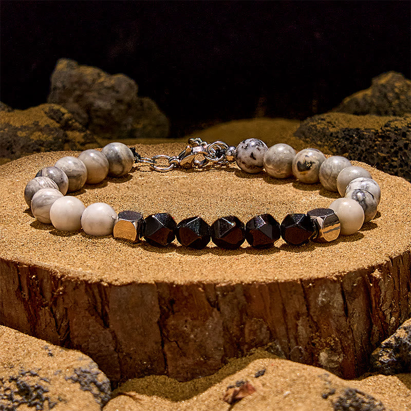 Olivenorma Facettiertes Perlenarmband aus schwarzem Onyx und grauem Jaspis