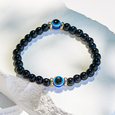 Olivenorma Armband mit Perlen aus natürlichem schwarzen Onyx und bösem Blick