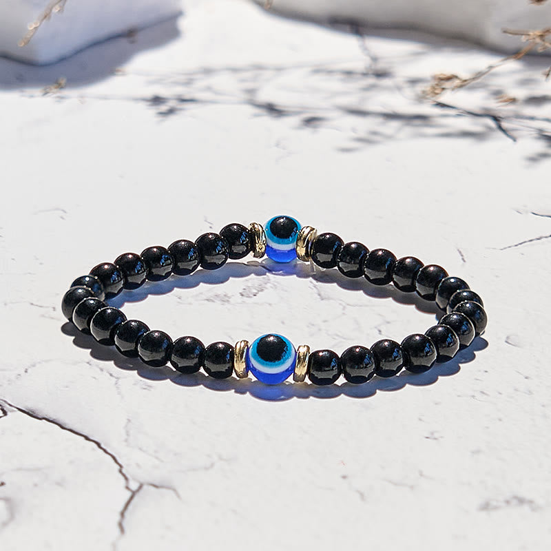 Olivenorma Armband mit Perlen aus natürlichem schwarzen Onyx und bösem Blick