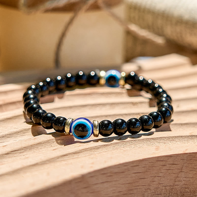 Olivenorma Armband mit Perlen aus natürlichem schwarzen Onyx und bösem Blick