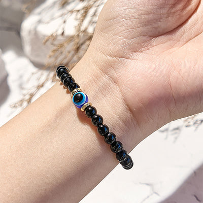 Olivenorma Armband mit Perlen aus natürlichem schwarzen Onyx und bösem Blick