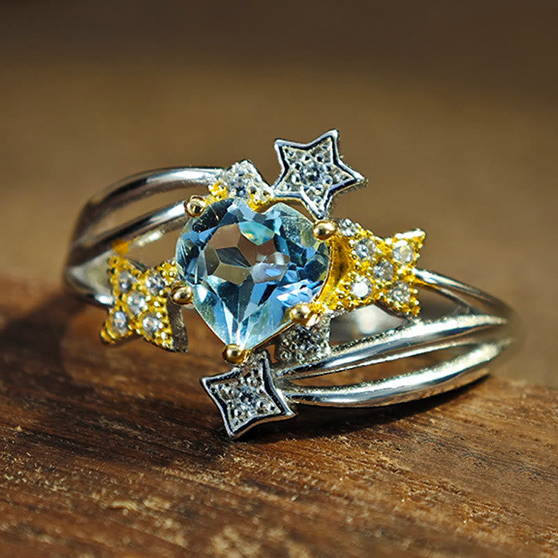 Olivenorma Ring mit natürlichem Blautopas und Herzstern