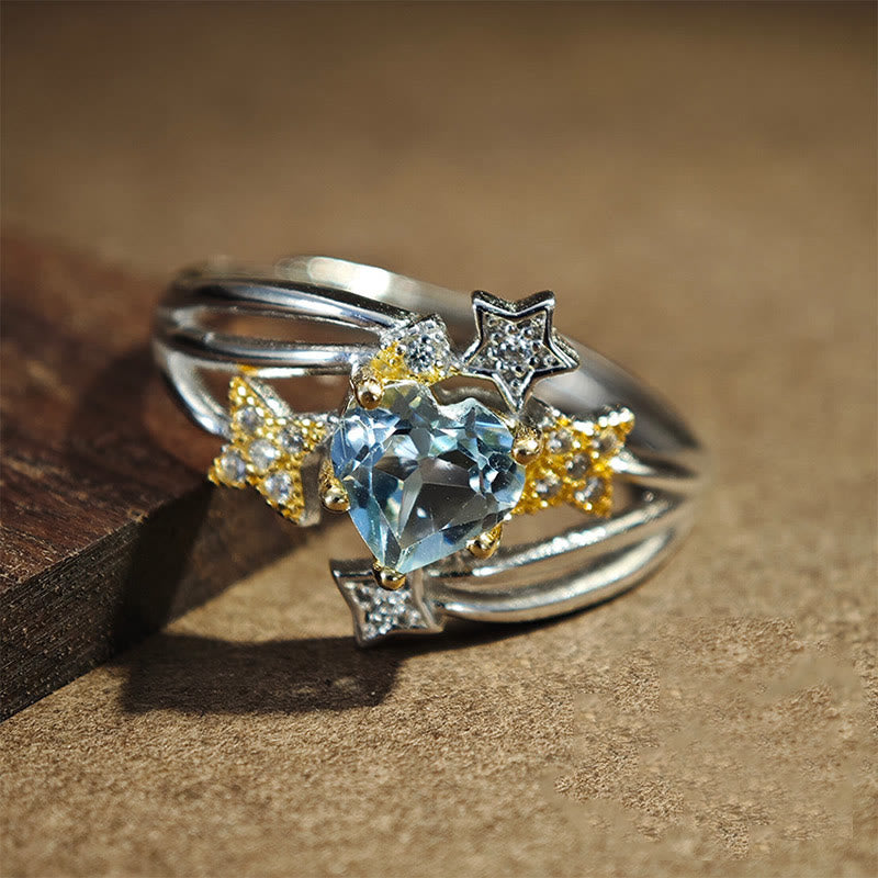 Olivenorma Ring mit natürlichem Blautopas und Herzstern