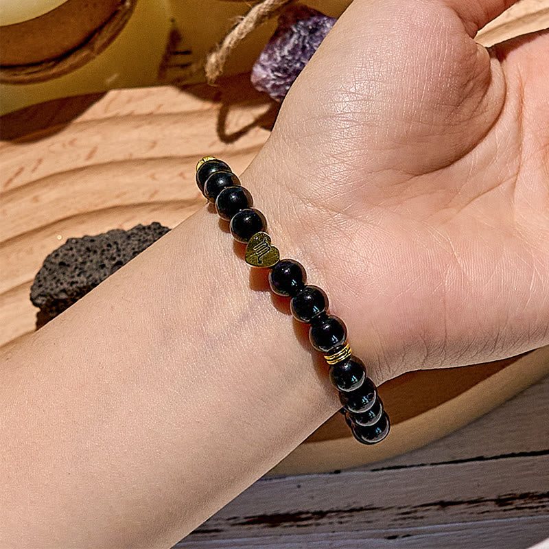 Olivenorma Armband aus natürlichem Obsidian mit Sternzeichen-Perlen 