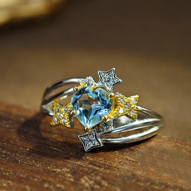 Olivenorma Ring mit natürlichem Blautopas und Herzstern