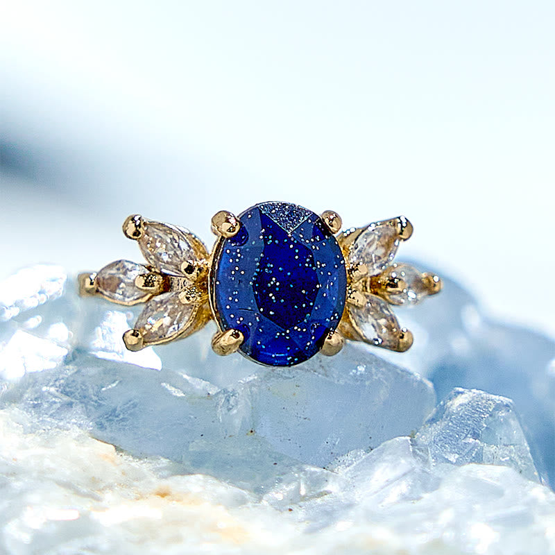 Olivenorma Ring mit Blatt aus blauem Sandstein mit Zirkonia und ovalem Schliff