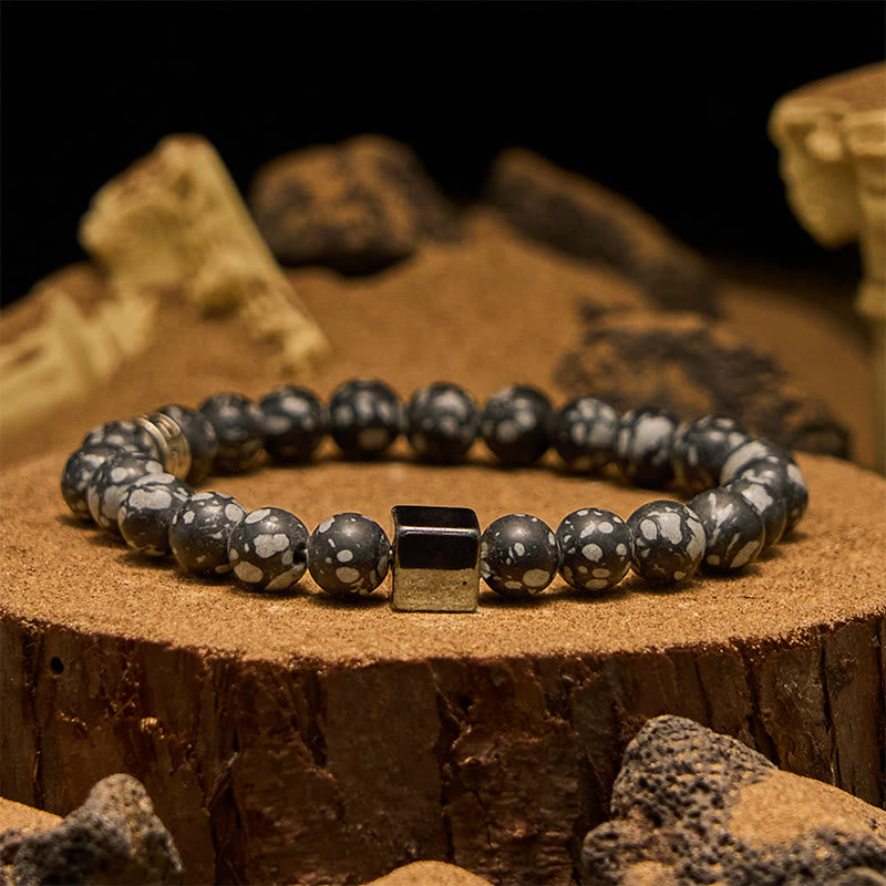 Olivenorma Schneeflocken-Obsidian-Armband mit Hämatit-Perlen im Quadratschliff