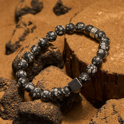 Olivenorma Schneeflocken-Obsidian-Armband mit Hämatit-Perlen im Quadratschliff