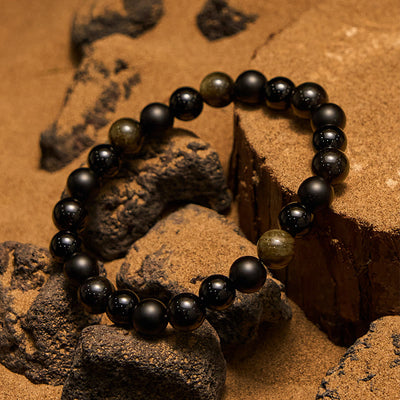 Olivenorma Herrenarmband mit schwarzen Onyx- und goldenen Obsidianperlen