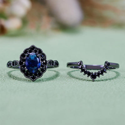 Olivenorma Brautset mit ovalem Saphir und Blumenmuster in Schwarz und Gold