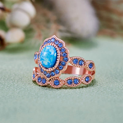 Olivenorma 2-teiliges Ringset aus Roségold mit blauem Opal und Saphir