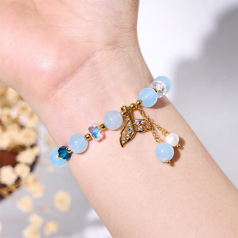 Olivenorma Aquamarin-Armband mit klaren Glasperlen und Walschwanz