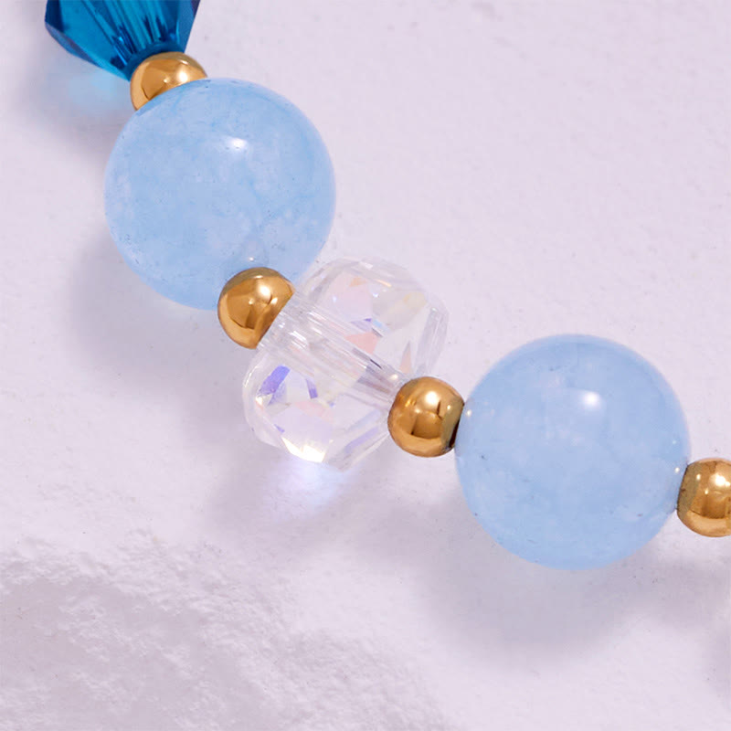 Olivenorma Aquamarin-Armband mit klaren Glasperlen und Walschwanz