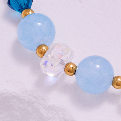 Olivenorma Aquamarin-Armband mit klaren Glasperlen und Walschwanz