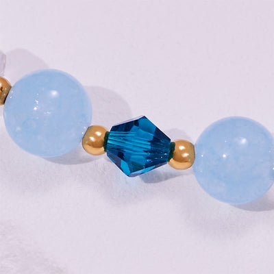 Olivenorma Aquamarin-Armband mit klaren Glasperlen und Walschwanz