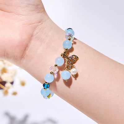 Olivenorma Aquamarin-Armband mit klaren Glasperlen und Walschwanz
