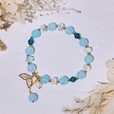 Olivenorma Aquamarin-Armband mit klaren Glasperlen und Walschwanz