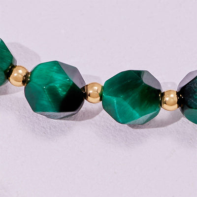 Olivenorma Armband mit facettierten grünen Tigeraugenperlen