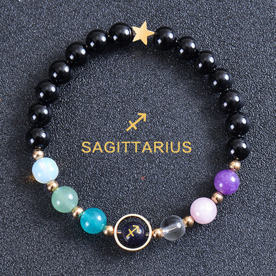 Olivenorma Edelsteinarmband mit zwölf Sternbildern und acht Planeten - Runder Obsidian - Schütze - image 48