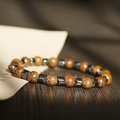 Olivenorma 8 mm Lavastein-Hämatit-Stretch-Perlenarmband - Hämatit + Holzperlen - image 8