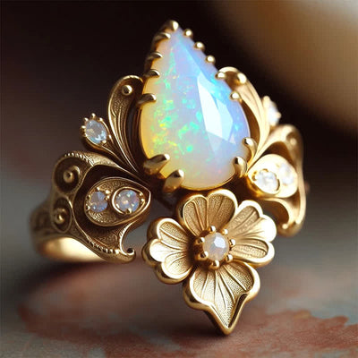 Olivenorma „Tränen der Sonne“ Feueropal-Blumenring - US 10 - image 0