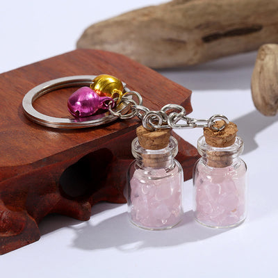 Olivenorma Natürliche Kristallsplitter in Mini-Glasflasche als Schlüsselanhänger mit Glöckchen - Rosa Kristall - image 5