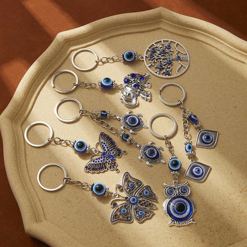 Olivenorma Kreativer Schlüsselanhänger mit blauem bösen Blick und Tier-/Pflanzendetails - Schildkröte - image 0