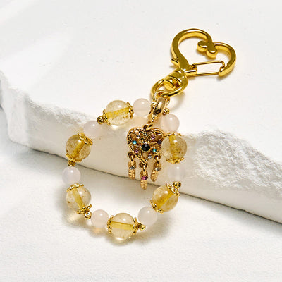 Olivenorma Schlüsselanhänger aus klarem Kristall und goldfarbenem Rutilquarz, Kristall-Handyanhänger - Klarer Kristall und goldfarbener Rutilquarz - image 0