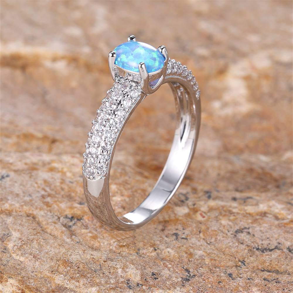 Olivenorma "Glänzende Eleganz" Runder Opal Zirkon Rand Ring