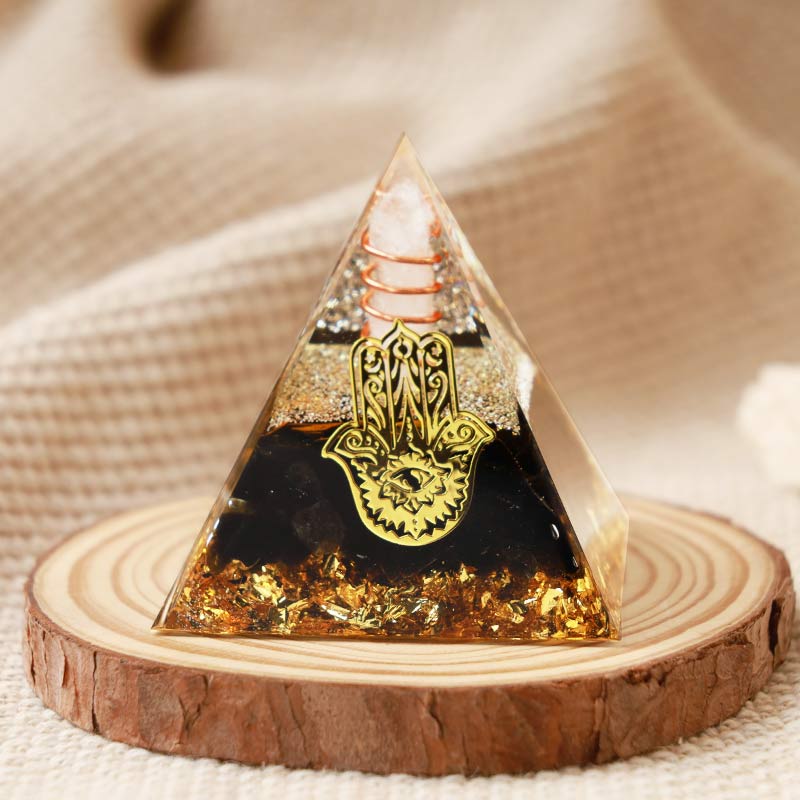 Olivenorma Klarer Kristall mit Obsidian Hamsa Orgonpyramide 