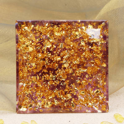 Olivenorma Sonnenstein Kugel mit Amethyst-Orgonpyramide