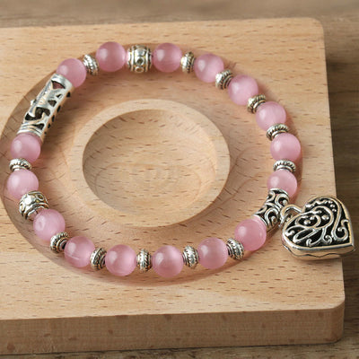 Olivenorma Hohl-Liebe-Anhänger Pink-Katzenauge-Armband 