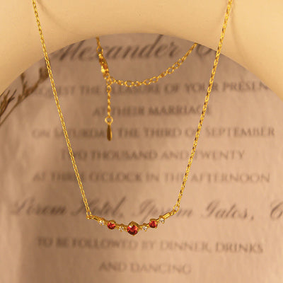 Olivenorma "Symbol der Unabhängigkeit" Granat Diamant Halskette