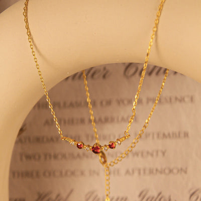 Olivenorma "Symbol der Unabhängigkeit" Granat Diamant Halskette